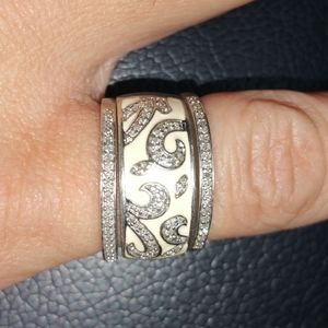 1/4 CT. T.W. Diamond and White Enamel Swirl Ring